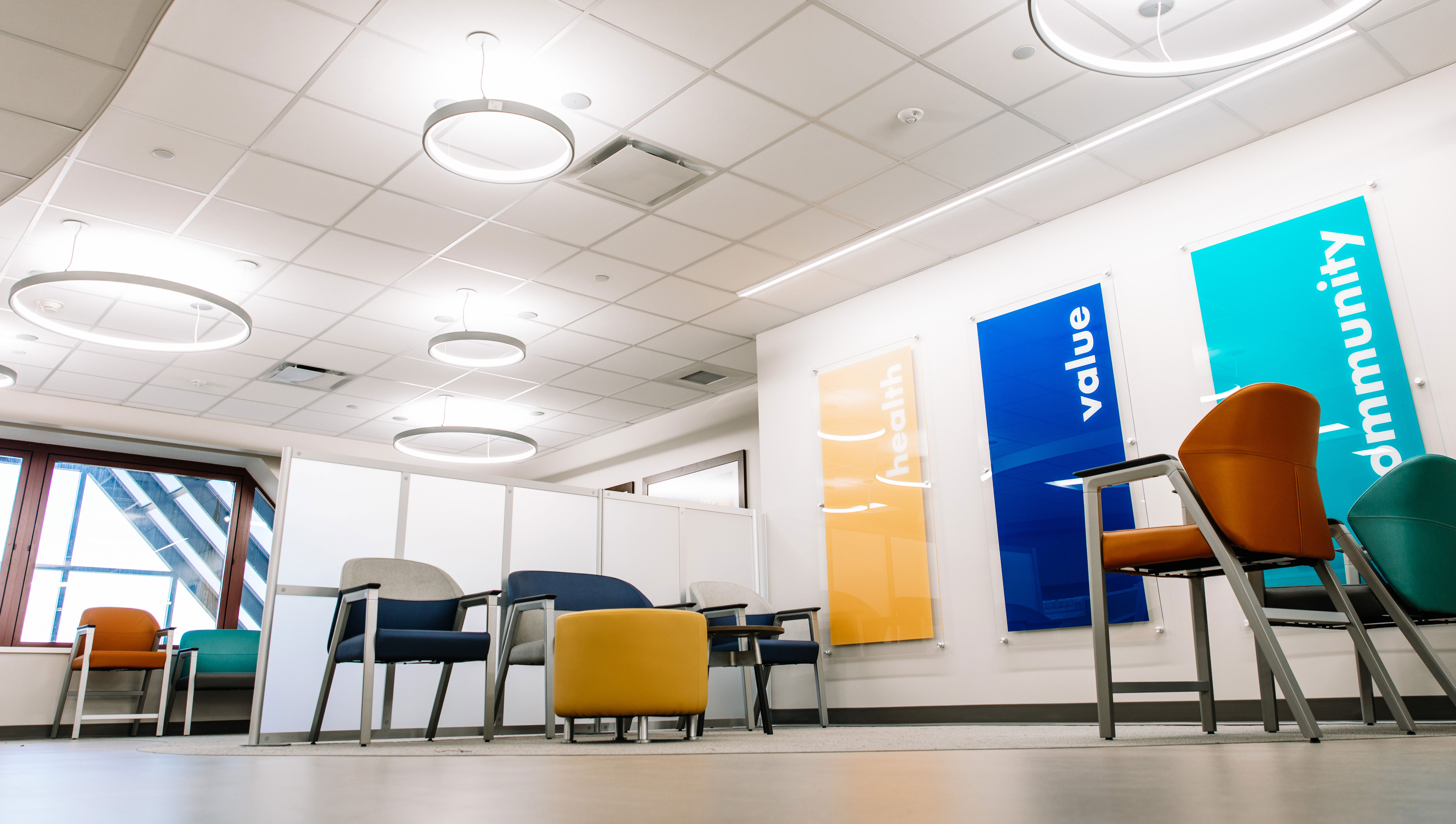 The waiting area offers comfortable seating in a bright, clean and modern space.